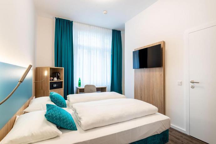 Imagen de la habitación del Hotel DaunTown Rooms - Self Check-In. Foto 4