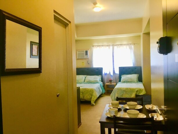 Imagen de la habitación del Hotel Davao Avida Towers By Jyu. Foto 24