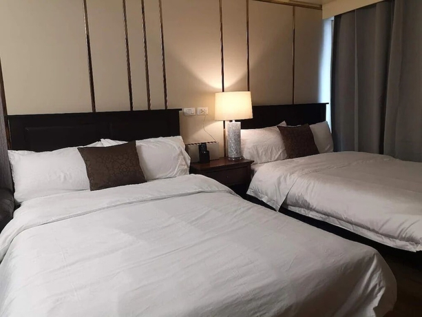 Imagen de la habitación del Hotel Davao Central Suites. Foto 9