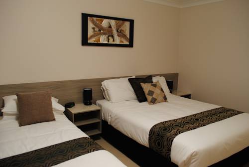 Imagen de la habitación del Hotel David Motor Inn. Foto 4