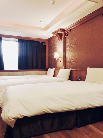 Imagen de la habitación del Hotel Daxin. Foto 6