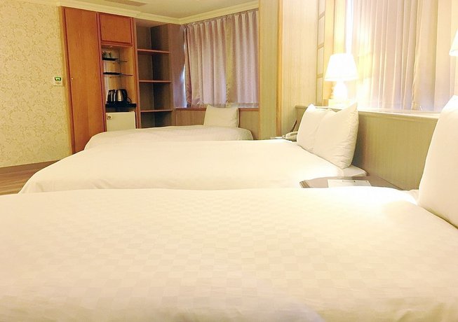 Imagen de la habitación del Hotel Daxin. Foto 15