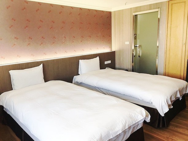 Imagen de la habitación del Hotel Daxin. Foto 18