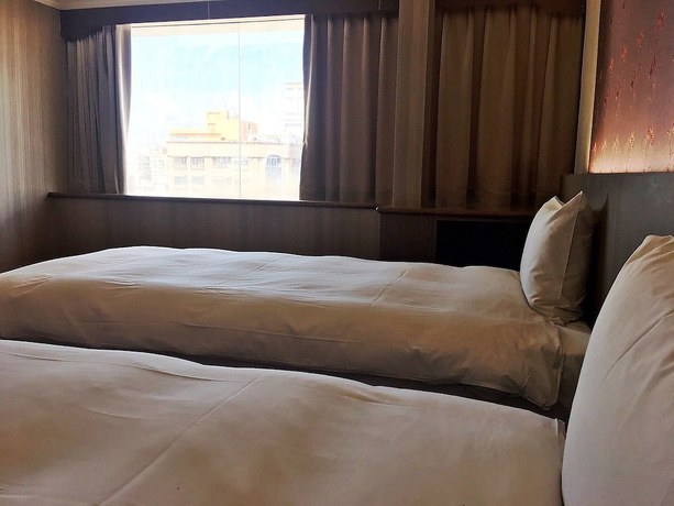 Imagen de la habitación del Hotel Daxin. Foto 19