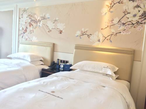 Imagen de la habitación del Hotel Dayhello International. Foto 13