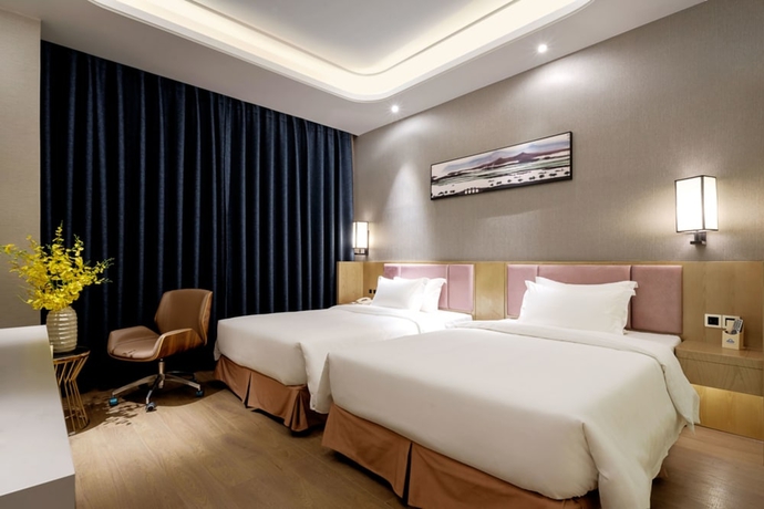 Imagen de la habitación del Hotel Days By Wyndham Guangzhou Hantian. Foto 7