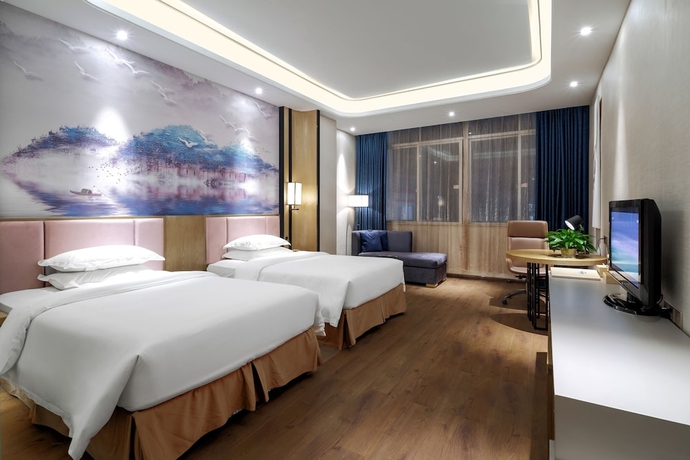 Imagen de la habitación del Hotel Days By Wyndham Guangzhou Hantian. Foto 10