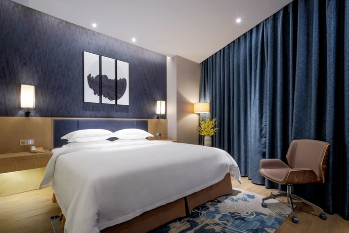 Imagen de la habitación del Hotel Days By Wyndham Guangzhou Hantian. Foto 13