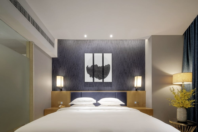 Imagen de la habitación del Hotel Days By Wyndham Guangzhou Hantian. Foto 14