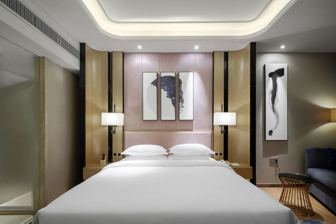 Imagen de la habitación del Hotel Days By Wyndham Guangzhou Hantian. Foto 16
