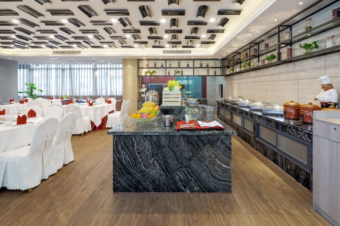Imagen del bar/restaurante del Hotel Days By Wyndham Guangzhou Hantian. Foto 6