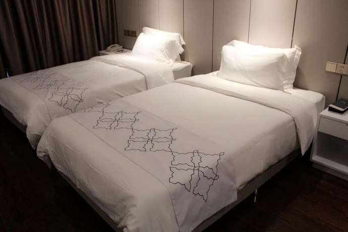 Imagen de la habitación del Hotel Days Inn Business Place Goldwin Yantai. Foto 8