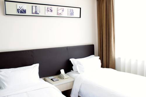 Imagen de la habitación del Hotel Days Inn Frontier Qingdao Airport. Foto 3