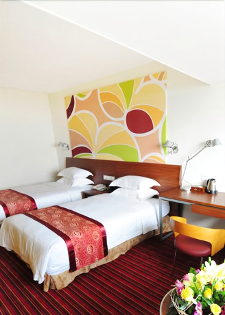 Imagen de la habitación del Hotel Days Inn Guangzhou. Foto 12