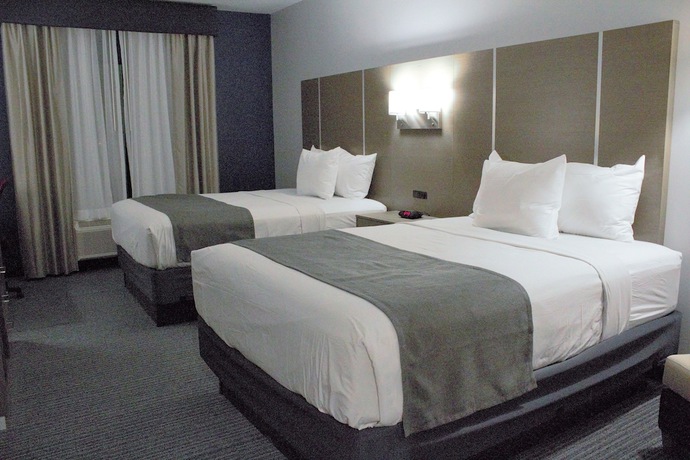 Imagen de la habitación del Hotel Days Inn and Suites By Wyndham Houston Nw Cypress. Foto 6