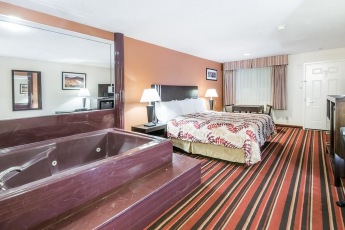 Imagen de la habitación del Hotel Days Inn and Suites By Wyndham Winnie. Foto 12