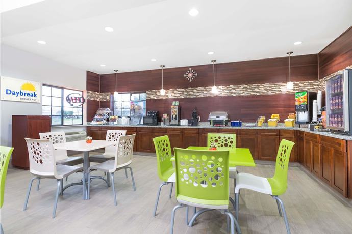 Imagen del bar/restaurante del Hotel Days Inn and Suites by Wyndham Madisonville. Foto 4