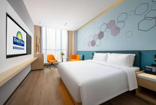 Imagen de la habitación del Hotel Days Inn by Wyndham Zhuhai Gongbei Port. Foto 10