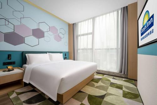 Imagen de la habitación del Hotel Days Inn by Wyndham Zhuhai Gongbei Port. Foto 12