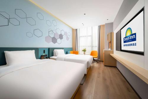 Imagen de la habitación del Hotel Days Inn by Wyndham Zhuhai Gongbei Port. Foto 13