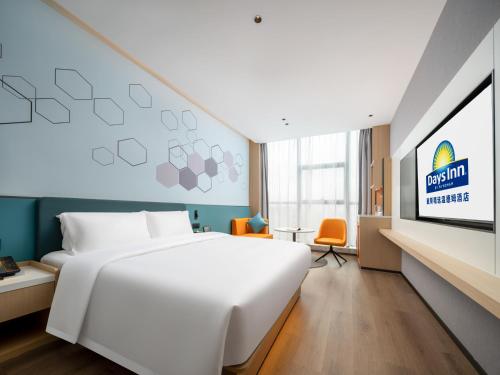 Imagen de la habitación del Hotel Days Inn by Wyndham Zhuhai Gongbei Port. Foto 15