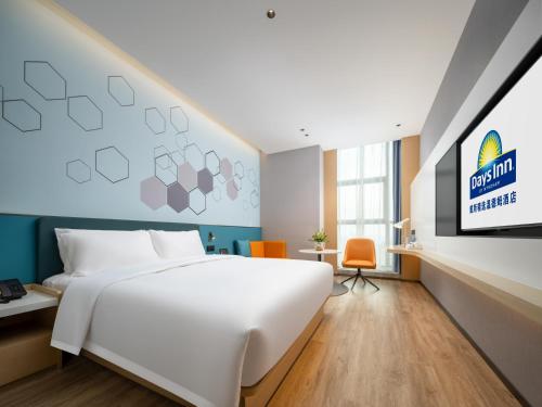 Imagen de la habitación del Hotel Days Inn by Wyndham Zhuhai Gongbei Port. Foto 16