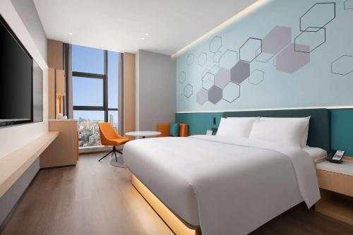 Imagen de la habitación del Hotel Days Inn by Wyndham Zhuhai Gongbei Port. Foto 19