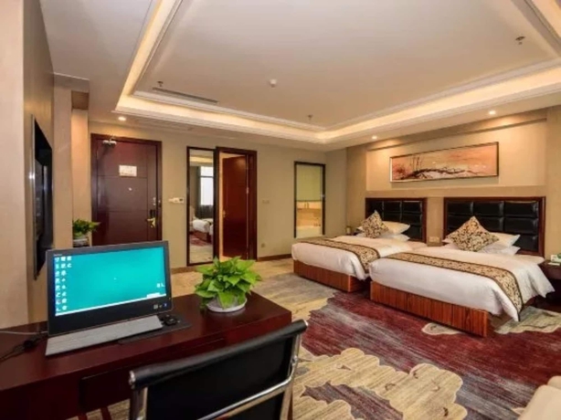 Imagen de la habitación del Hotel Days and Suites Shishi. Foto 9