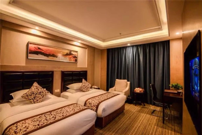 Imagen de la habitación del Hotel Days and Suites Shishi. Foto 13