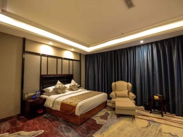 Imagen de la habitación del Hotel Days and Suites Shishi. Foto 14