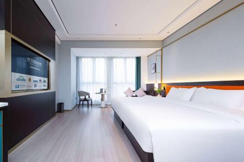 Imagen de la habitación del Hotel Days by Wyndham Changsha Kaifu. Foto 9
