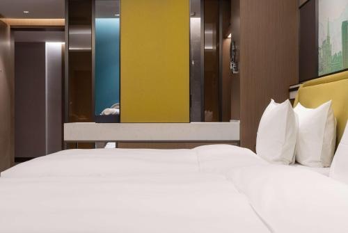 Imagen de la habitación del Hotel Days by Wyndham Chongqing Chenjiaping. Foto 16