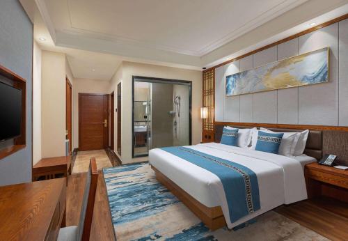 Imagen de la habitación del Hotel Days by Wyndham Dali High-speed Railway Station. Foto 11