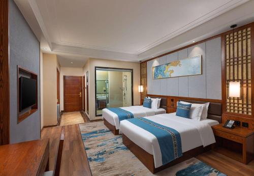Imagen de la habitación del Hotel Days by Wyndham Dali High-speed Railway Station. Foto 12