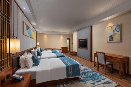 Imagen de la habitación del Hotel Days by Wyndham Dali High-speed Railway Station. Foto 16