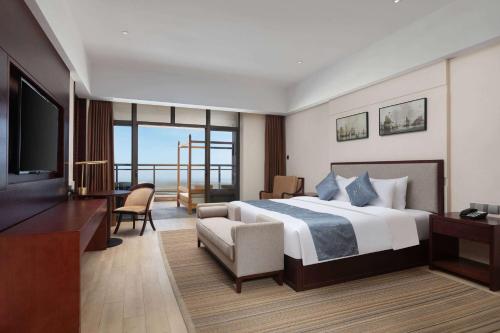 Imagen de la habitación del Hotel Days by Wyndham Fangchenggang Bailang Beach. Foto 16