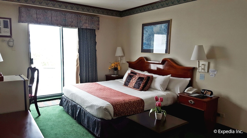 Imagen de la habitación del Hotel Days by Wyndham Tagaytay. Foto 10
