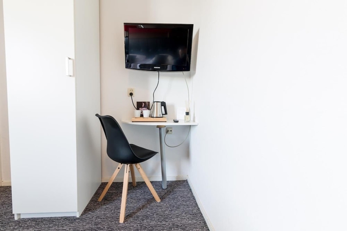 Imagen de la habitación del Hotel De Buizerd. Foto 11