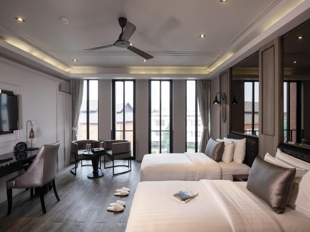 Imagen de la habitación del Hotel De Chai the Deco Chiang Mai. Foto 4