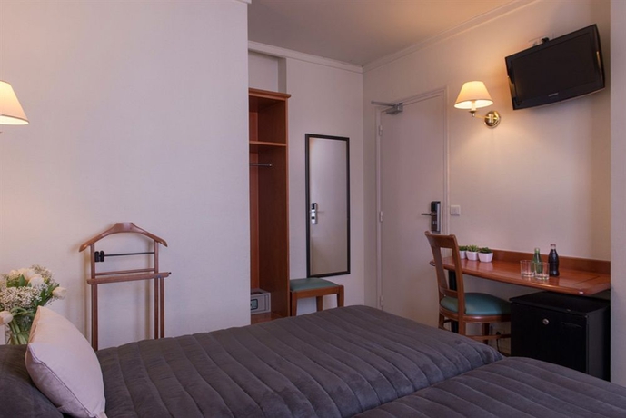 Imagen de la habitación del Hotel De Geneve, París. Foto 6