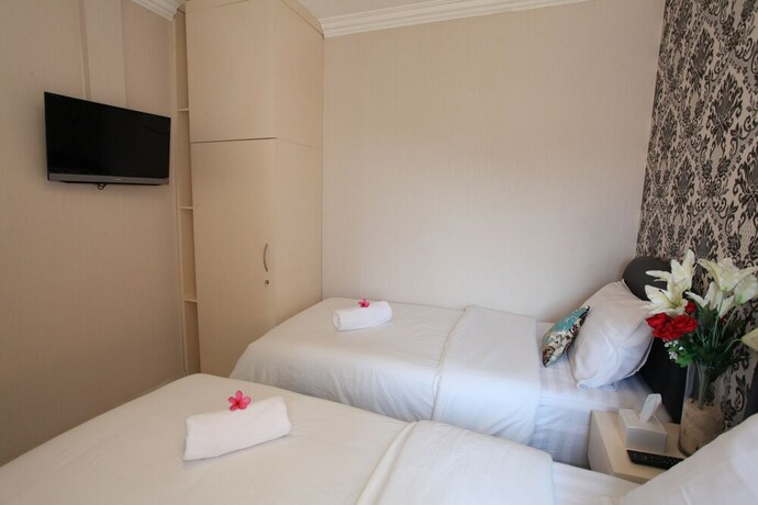 Imagen de la habitación del Hotel De Green Inn. Foto 21