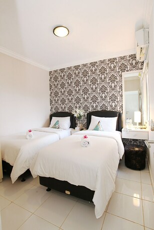 Imagen de la habitación del Hotel De Green Inn. Foto 23