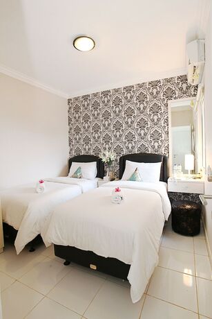 Imagen de la habitación del Hotel De Green Inn. Foto 26