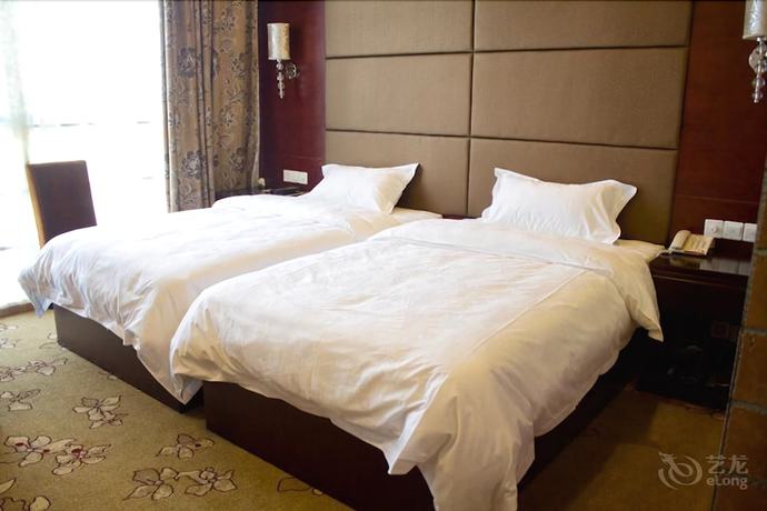 Imagen de la habitación del Hotel De Hua Tang Bed Culture Hotel. Foto 14