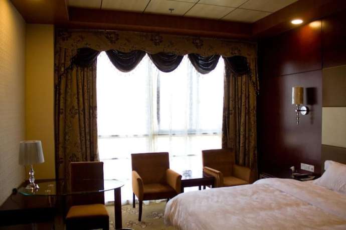 Imagen de la habitación del Hotel De Hua Tang Bed Culture Hotel. Foto 15