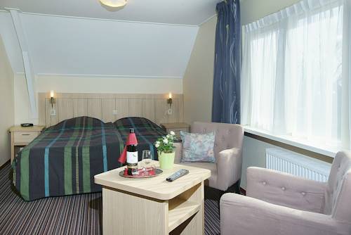 Imagen de la habitación del Hotel De Klok. Foto 8