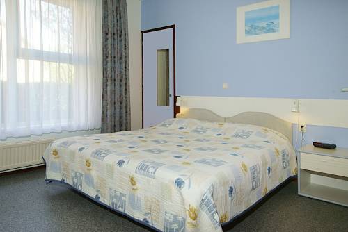 Imagen de la habitación del Hotel De Klok. Foto 14