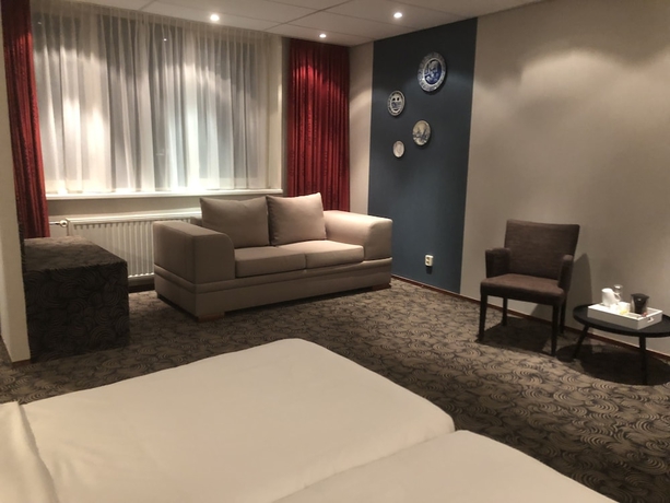 Imagen de la habitación del Hotel De Koophandel. Foto 11