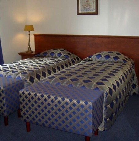 Imagen de la habitación del Hotel De Kroon. Foto 14