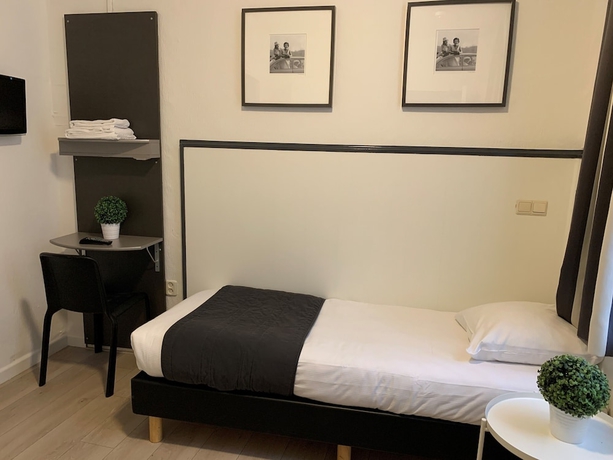 Imagen de la habitación del Hotel De La Bourse. Foto 7